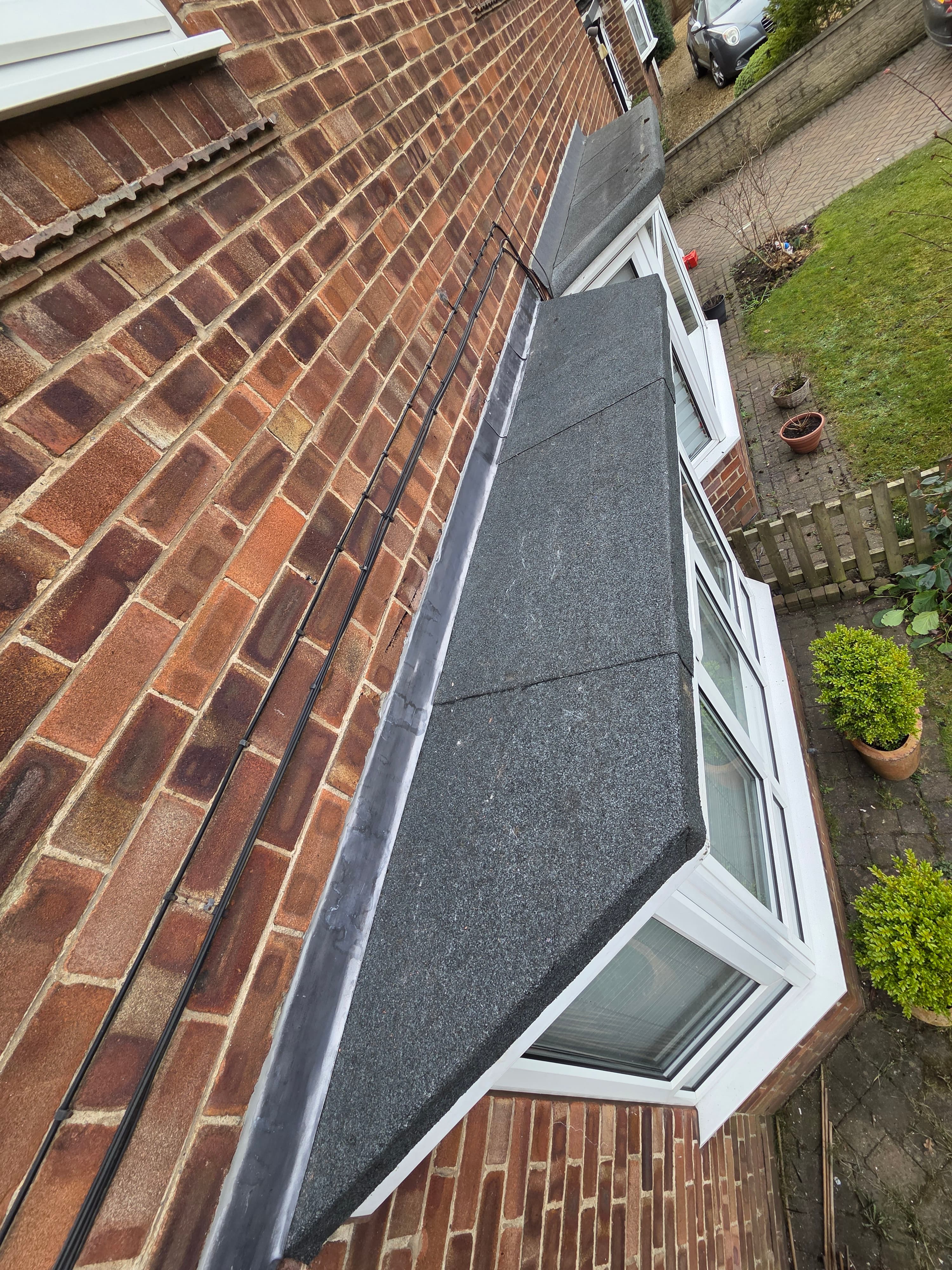 Bitumen bay flat roof with new lead flashing